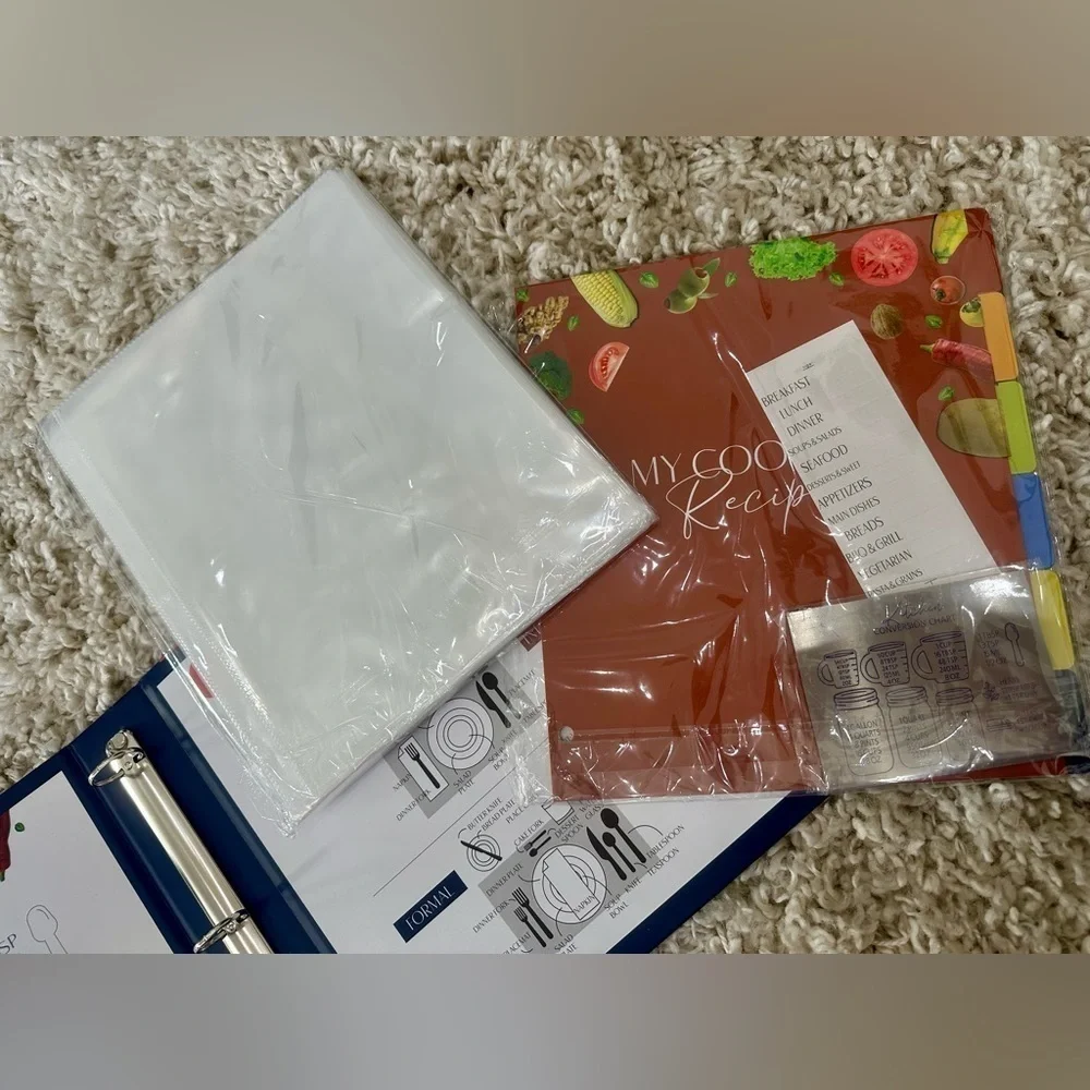 Recipe book with page protectors, dividers, and labels. New in box 11 x 11.5”